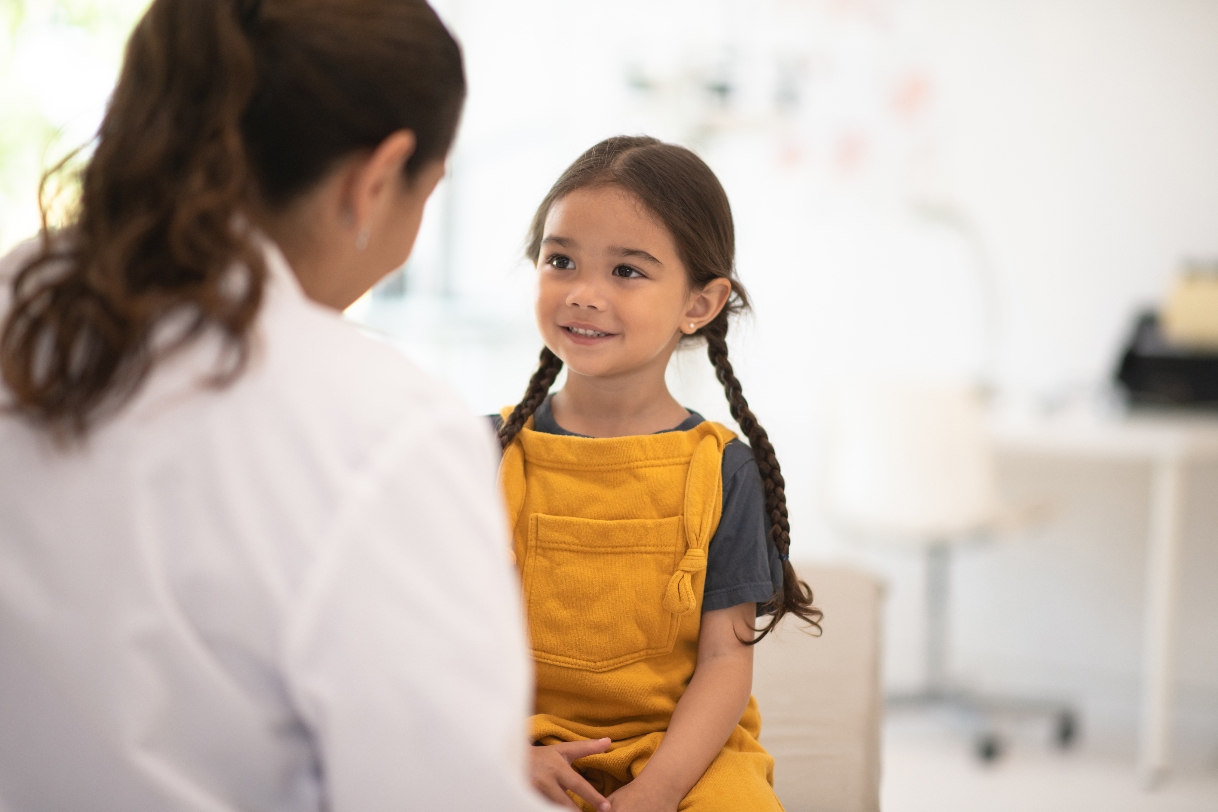 Little girl receiving a check up from her Doctor